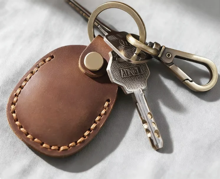 Leather key holder hardware and stitching detail for OEM review