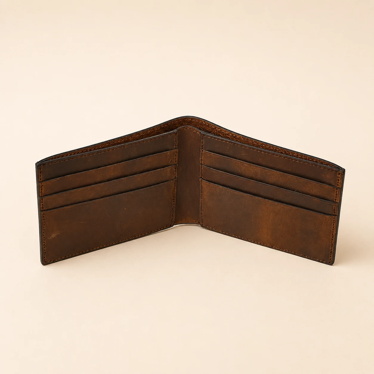Open brown bifold wallet showing six card slots
